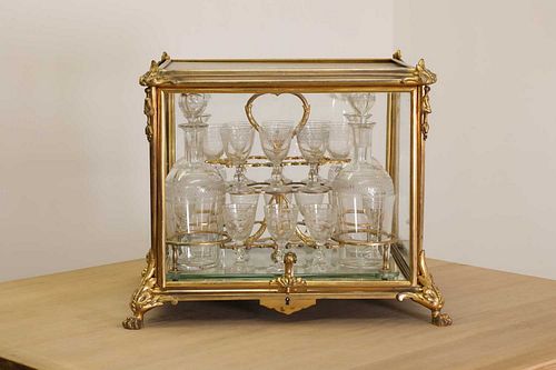 A French Napoleon III ormolu and glass cave ? liqueur,
