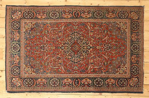 A Persian wool rug,