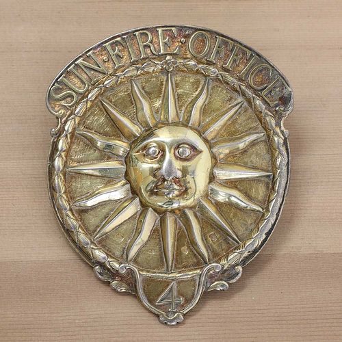 A George III silver gilt Sun Fire Office fireman's arm badge,