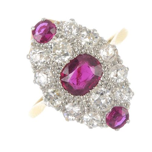 A mid 20th century 18ct gold and platinum, ruby and diamond dress ring. Of marquise-shape outline, t