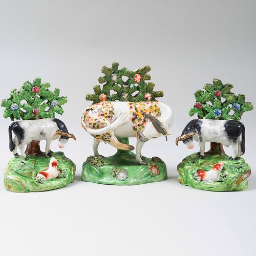 Pair of Staffordshire Bocage Figure Groups of Cows and a Bocage Figure of a Cow Kicking a Snake