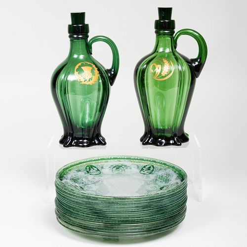 Set of Sixteen Bohemian Green Cased and Etched Glass Plates and a Pair Gilt-Decorated Decanters