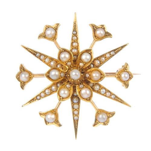 An early 20th century 15ct gold split pearl star brooch. The split pearl flower, within a similarly-