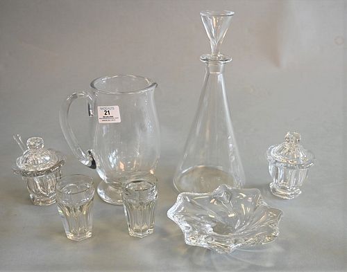Seven Piece Lot of Baccarat, to include a decanter, a pitcher, a pair of covered sugars, a bowl, along with a pair of small cups, each marked to the b