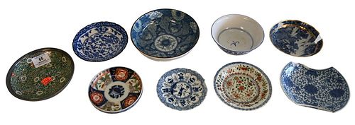 Ten Piece Lot of Asian Items, to include seven blue and white shallow dishes/bowls, an Imari saucer, a famille verte saucer, along with a porcelain bo
