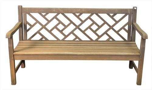 Teak Bench, having geometric openwork back, height 33 inches, length 60 inches. Provenance: Waterfront Estate, Stamford, CT.