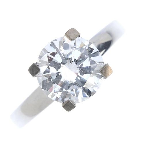 An 18ct gold diamond single-stone ring. The brilliant-cut diamond, weighing 2.04cts, raised to the p