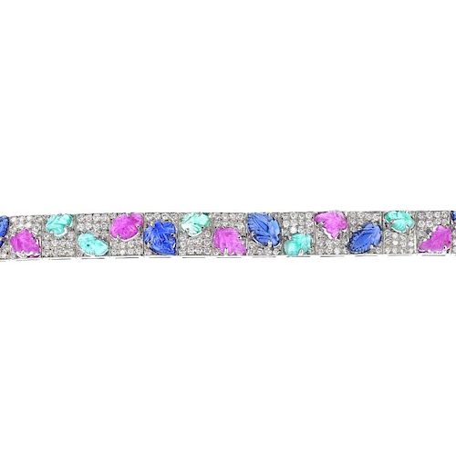 A gem-set and diamond foliate bracelet. The pave-set diamond articulated bracelet, with alternating