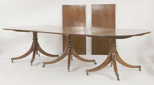 A Regency mahogany triple pedestal dining table, the