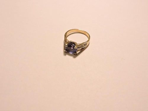 A single stone tanzanite ring, with diamond set claw tip and shoulders, tested as approximately 9ct