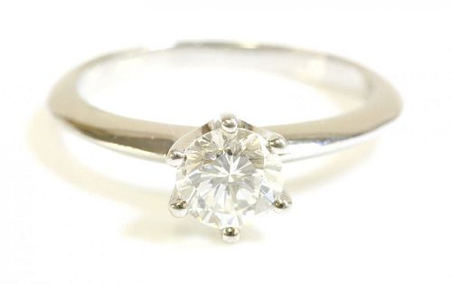 A platinum single stone diamond ring, with a brilliant