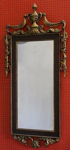 Carved and Giltwood Mirror with Urn and Tassel