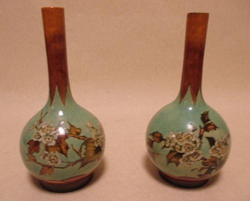 A pair of Royal Doulton faience bottle vases, 20cm high <br> <br>