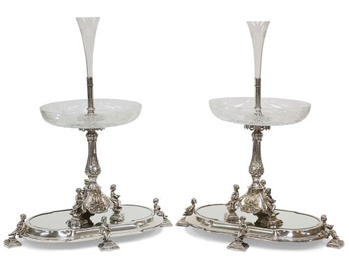 A HANDSOME PAIR OF 19TH CENTURY SILVER-PLATED CENTREPIECES ON MIRRORED STAN