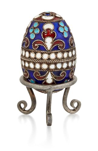 A RUSSIAN SMALL?SILVER AND ENAMEL EGG, stamped 'AK' and '84', pulling apart