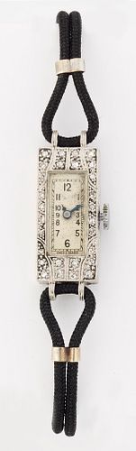 A DIAMOND COCKTAIL WATCH, the rectangular silvered dial with Arabic index a