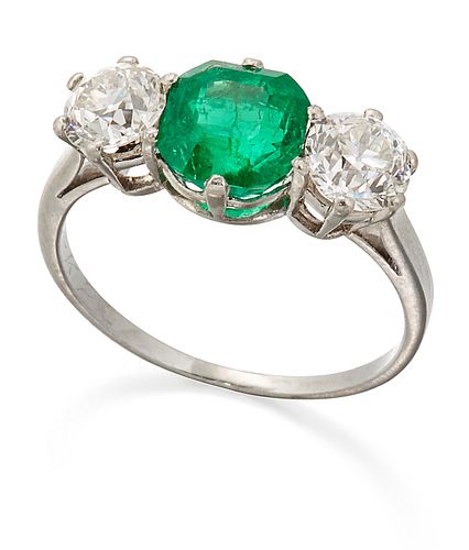 AN EMERALD AND DIAMOND THREE STONE RING, an octagonal-cut emerald between o