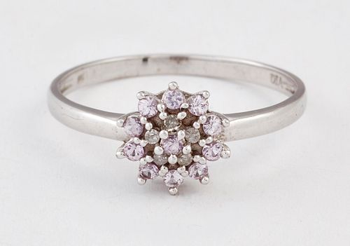 A 9 CARAT WHITE GOLD PINK STONE AND DIAMOND CLUSTER RING, set throughout wi