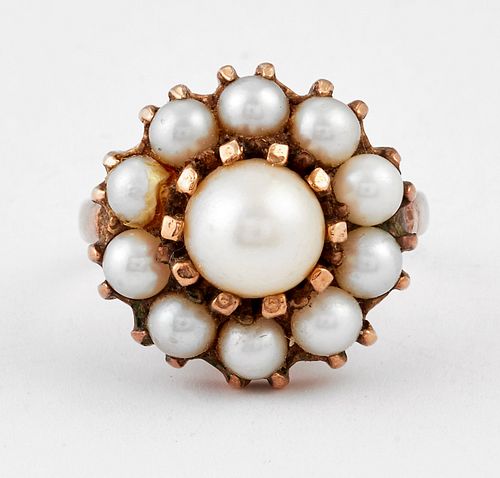 A CULTURED PEARL CLUSTER RING, a central cultured pearl within a border of 