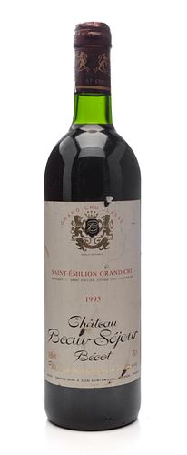 A bottle of Château Beau-Séjour Bécot, 1995.
Category: Red wine, Grand Cru. Saint Emilion (France).
Level: B.
75 cl.