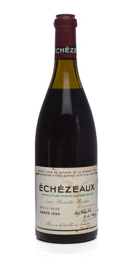 A bottle of Échezeaux, Domaine de la Romanée Contí, Vintage 1994.
Grand Cru.
Category: red wine. Vosne-Romanée, Còte d'Or (France).
Level: C-D.
Bottle