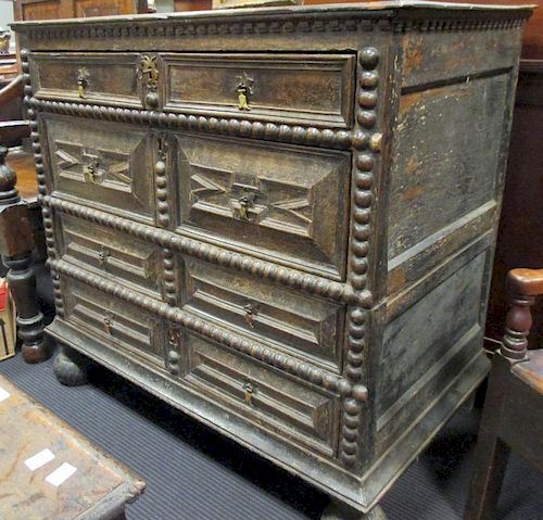 A 17th century oak geometric panel chest of drawers, 90 x 96cm <br> <br>