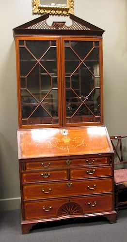 A 19th century mahogany and inlaid bureau bookcase, with glazed upper section and starburst inlay to