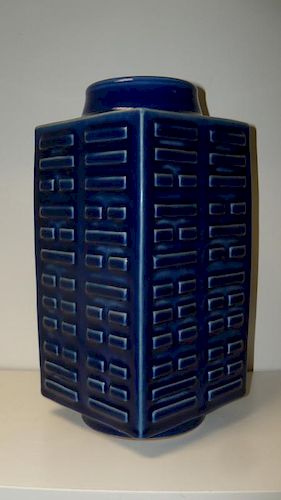 A blue cong shaped vase, the panel sides of the square sectioned shape moulded in relief with trigra