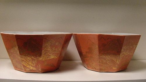 A pair of Republican orange ground planters, the decagonal sides gilt with island views opposite ins
