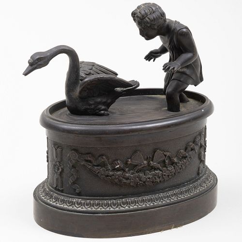 Patinated Metal Inkwell of a Child Chasing a Swan