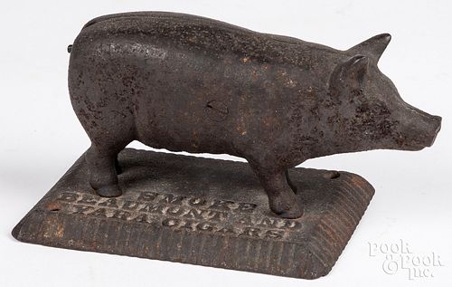 Cast iron figural advertising pig cigar cutter