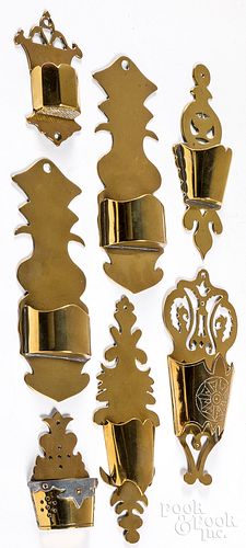 Seven brass wall pockets and match safes, 19th c.