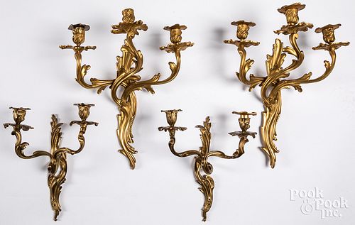 Two pairs of gilt brass wall candelabra