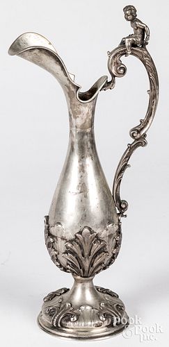 Unmarked silver ewer, with putti finial