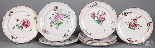 Eight tin glaze floral plates, 19th c.