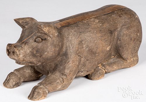 Carved figure of a recumbent pig, 20th c.