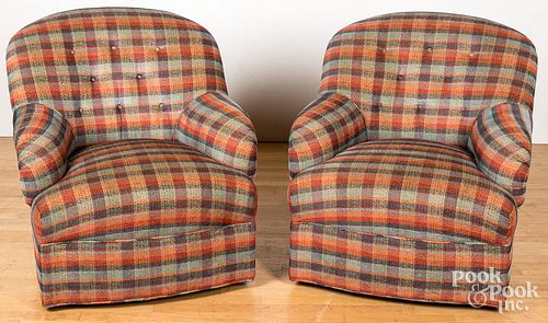 Pair of upholstered swivel easy chairs.