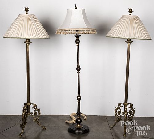 Pair of brass floor lamps and another lamp