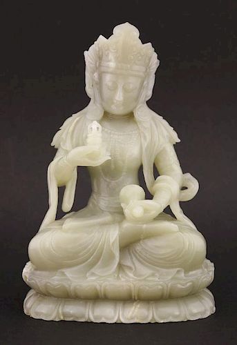 A jade Bodhisattva,<BR>20th century, the pale grey-green stone goddess seated cross-legged on a lotu