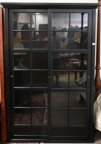 Contemporary China Cabinet, having two sliding doors opening to interior shelving, height 78 inches, width 49 inches.