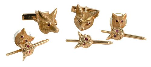 Seven Piece 14 Karat Tuxedo Set, to include cufflinks, there buttons, along with two tie tacs, all having fox heads with red eyes, 27.2 grams.