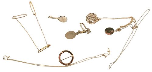 Group of Gold Jewelry, to include three 14 karat gold necklaces with pendants, 14 karat gold tennis racket pendant pin, along with bracelet, 17.4 gram
