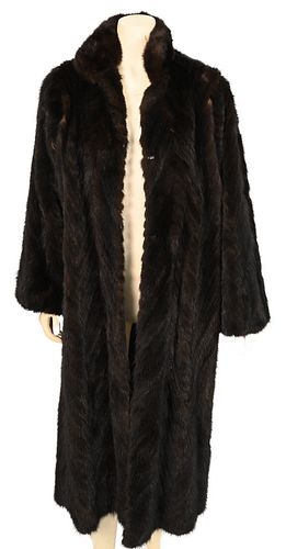 Vintage Herringbone Brown Mink Coat, having bell sleeves, stand up collar and front slip pockets, missing lining, fur is supple, size large.
