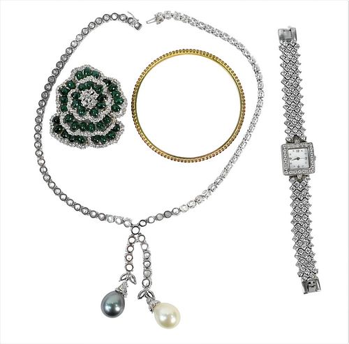 Three Piece Group of Costume Jewelry, to include M.C.J. green stone and rhinestone brooch, diamond simulant ladies watch, along with a diamond simulan