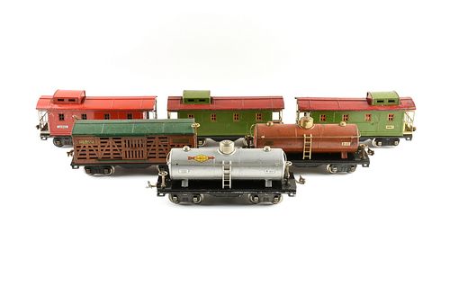 A GROUP OF LIONEL TRAIN TRACK SEGMENTS, SWITCHES, CAR TURNTABLE, AND CARS, PRE AND POST WORLD WAR II, 