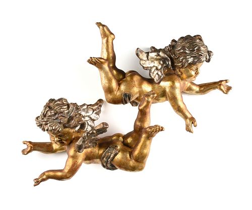 A PAIR OF VICTORIAN STYLE PARCEL GILT AND SILVER LEAFED WOOD CHERUB FIGURES, 20TH CENTURY,