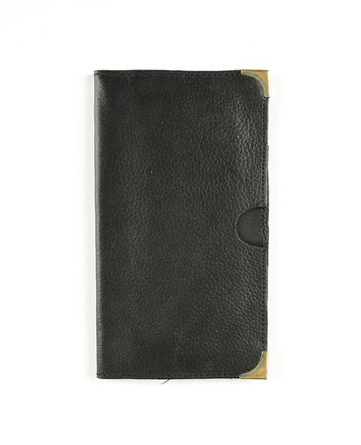 A MAGIC BLACK LEATHER WALLET WITH BRASS CORNER GUARDS, MODERN, 