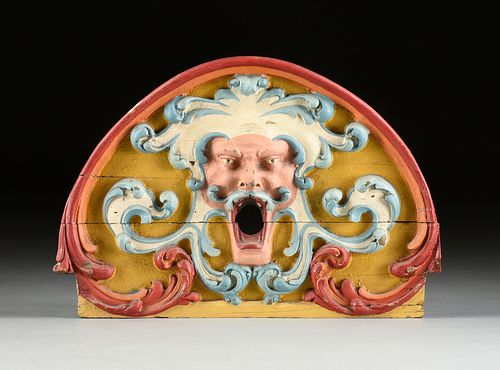 A RENAISSANCE REVIVAL PAINTED WOOD CIRCUS WAGON GROTESQUE MASK PANEL, LATE 19TH CENTURY,