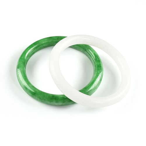 A GROUP OF TWO CHINESE WHITE JADE AND APPLE GREEN JADEITE BANGLE BRACELETS, MODERN, 