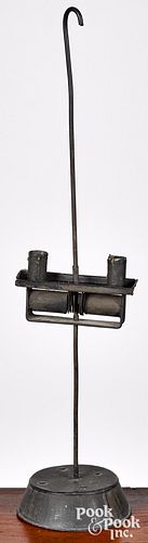 Adjustable weighted tin and iron candlestand
